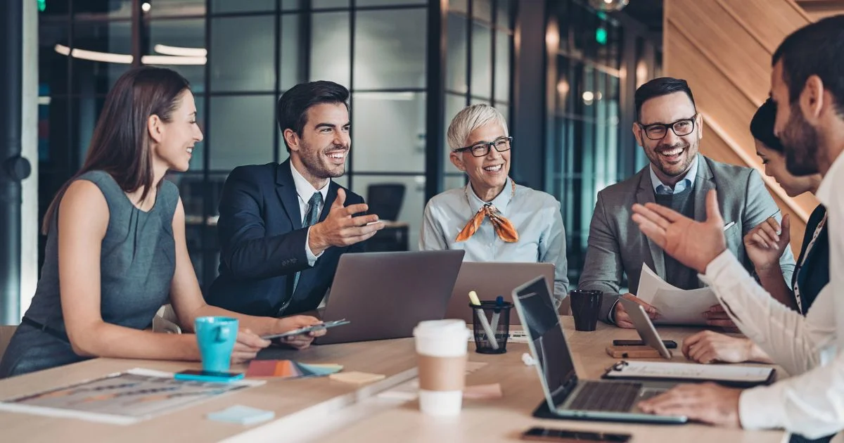 Diverse team collaborating in modern office meeting
